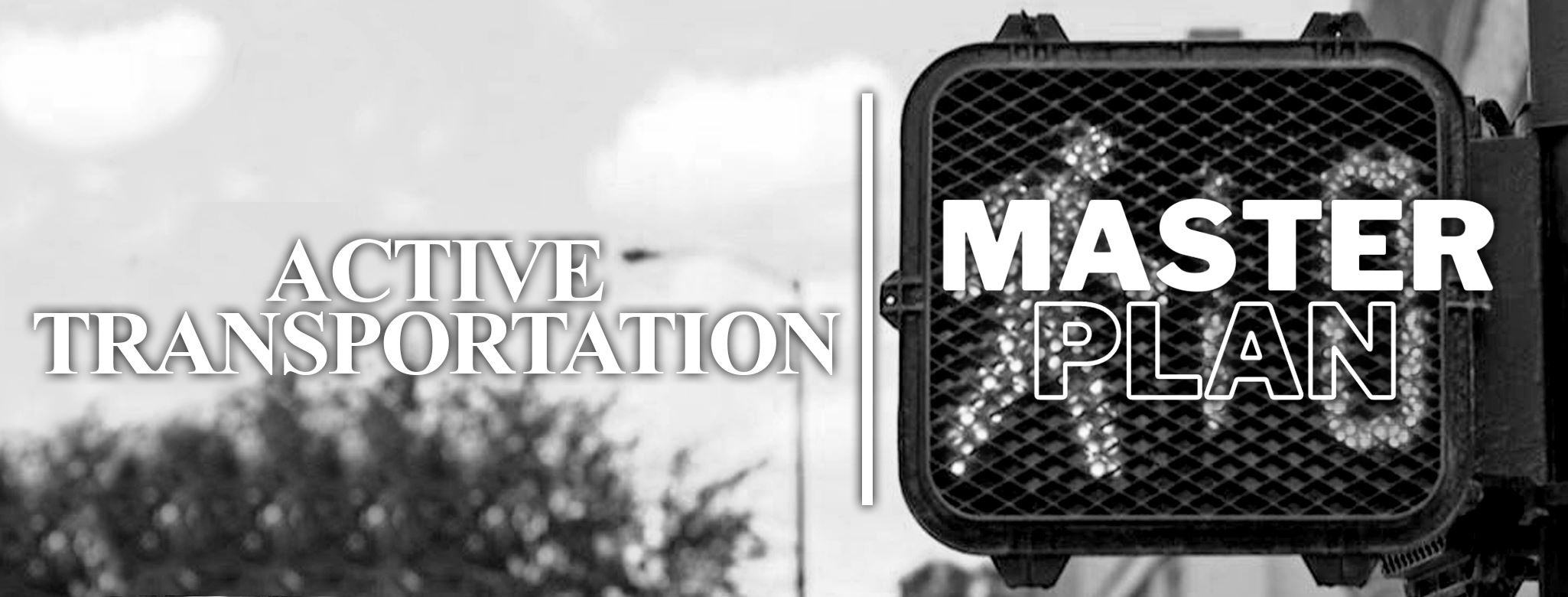 Banner with text reading Active Transportation Master Plan over a black and white photo 