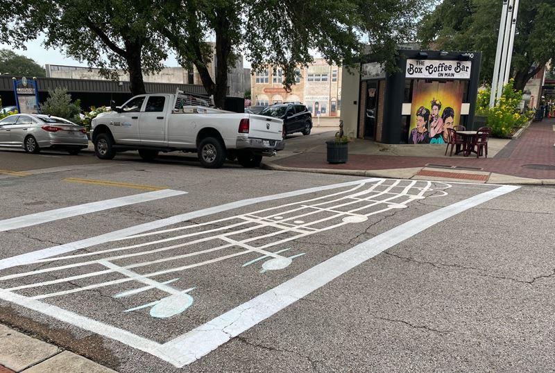 Crosswalk painted with musical notes