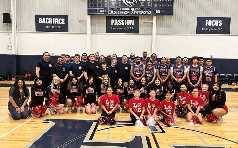 Large group photo on a basketball court