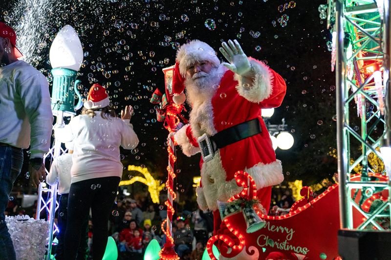 Santa Claus waving from a parade float