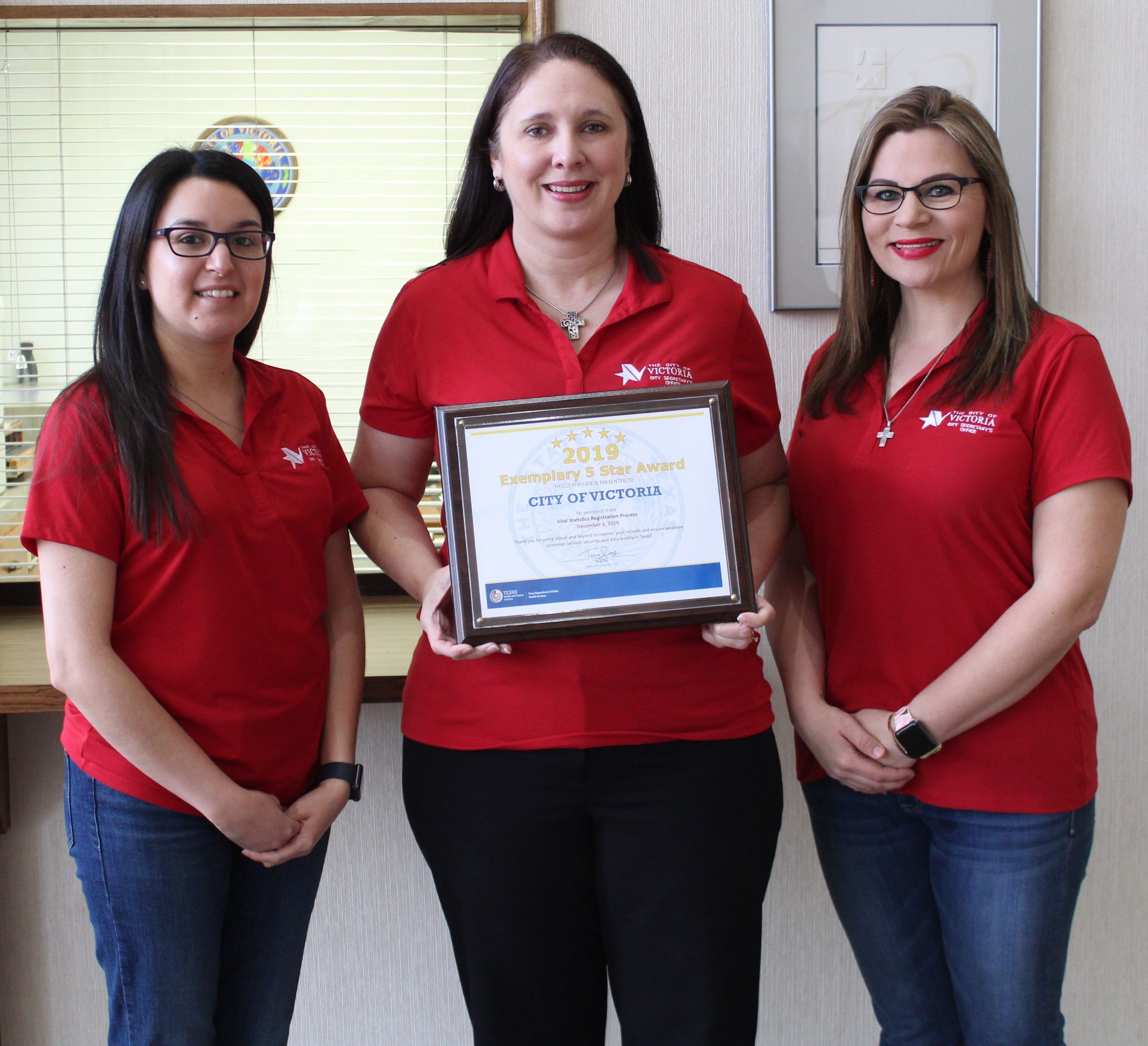 City Secretary's Office staff pose with award