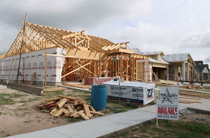 Three new homes in various states of construction