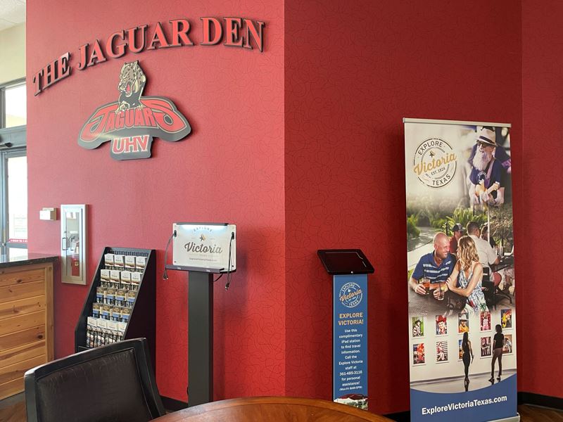 The Jaguar Den visitors area featuring iPad stand, chargers and a brochure rack