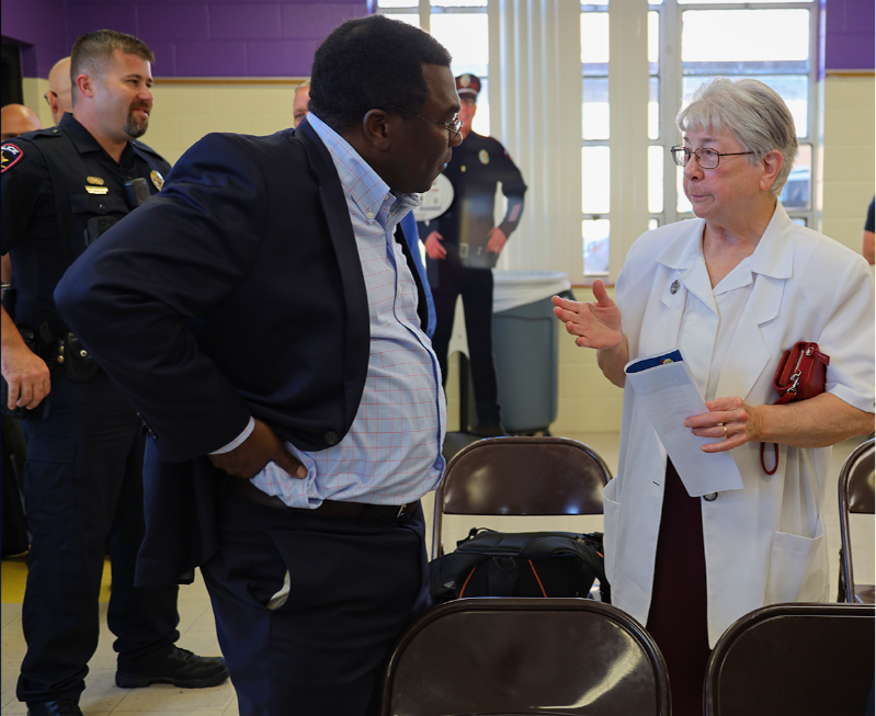 Citizens and Police Officers at a Community Meeting
