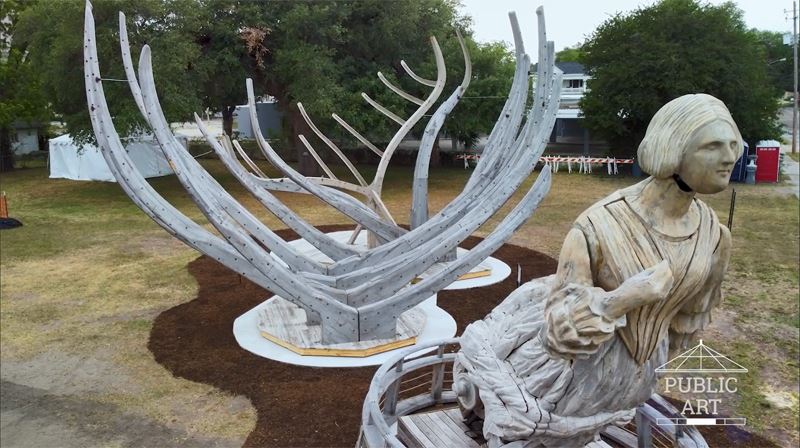 Wake, a giant sculpture of the framework of a ship and an oversized figurehead