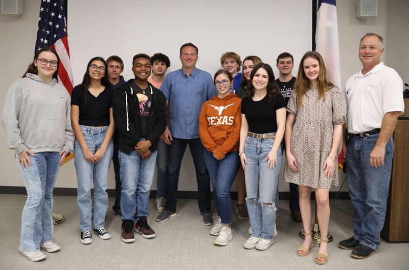 A group photo of students with Mayor Jeff Bauknight and Congressman Michael Cloud
