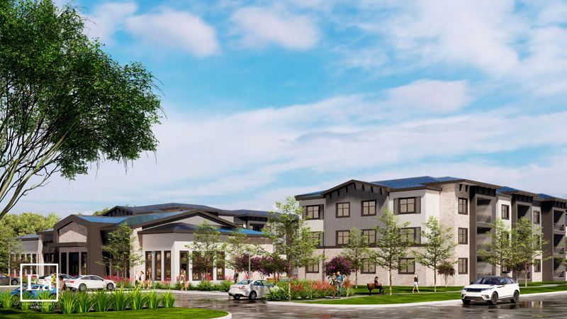 An apartment complex with multiple three-story buildings