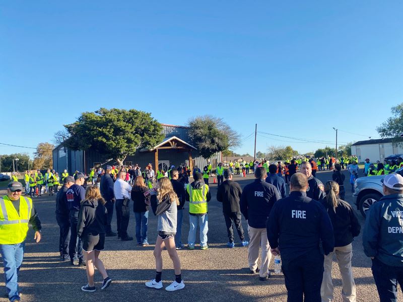 Large crowd of people in a church parking lot