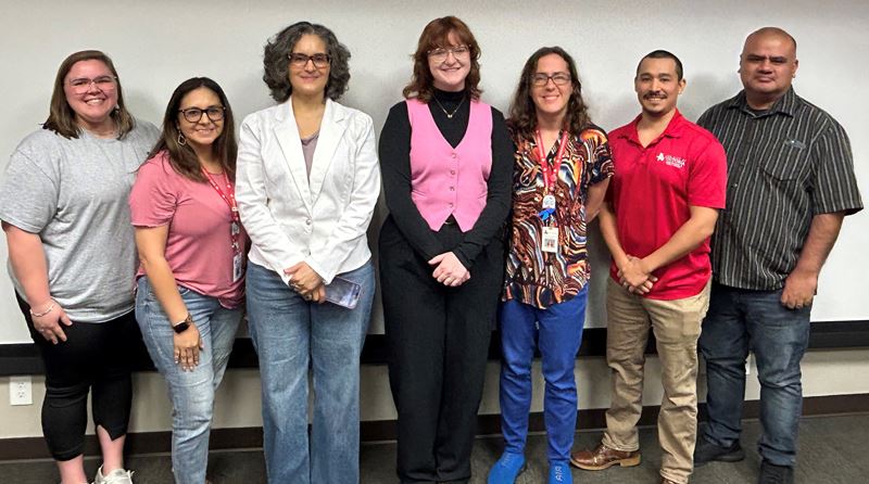 Group photo in City of Victoria conference room.