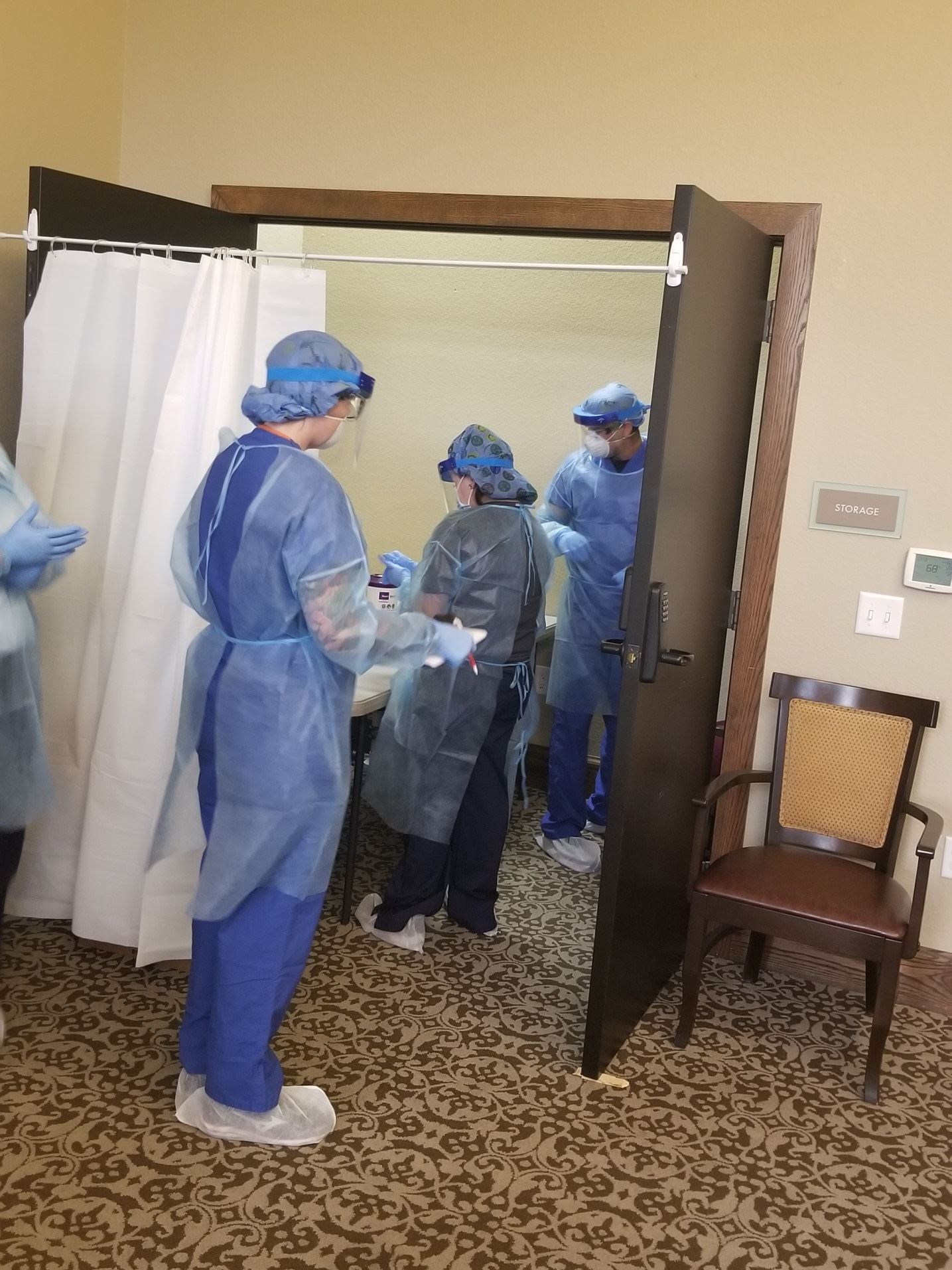 Fire department employees wearing scrubs