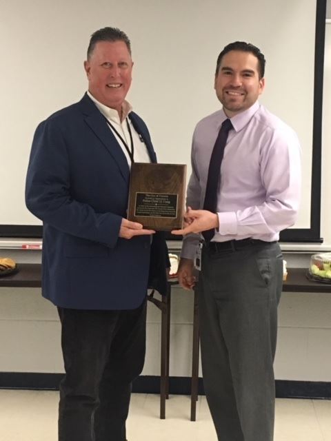 City Manager Jesús A. Garza presents Victoria Police Department Chief J.J. Craig with a plaque
